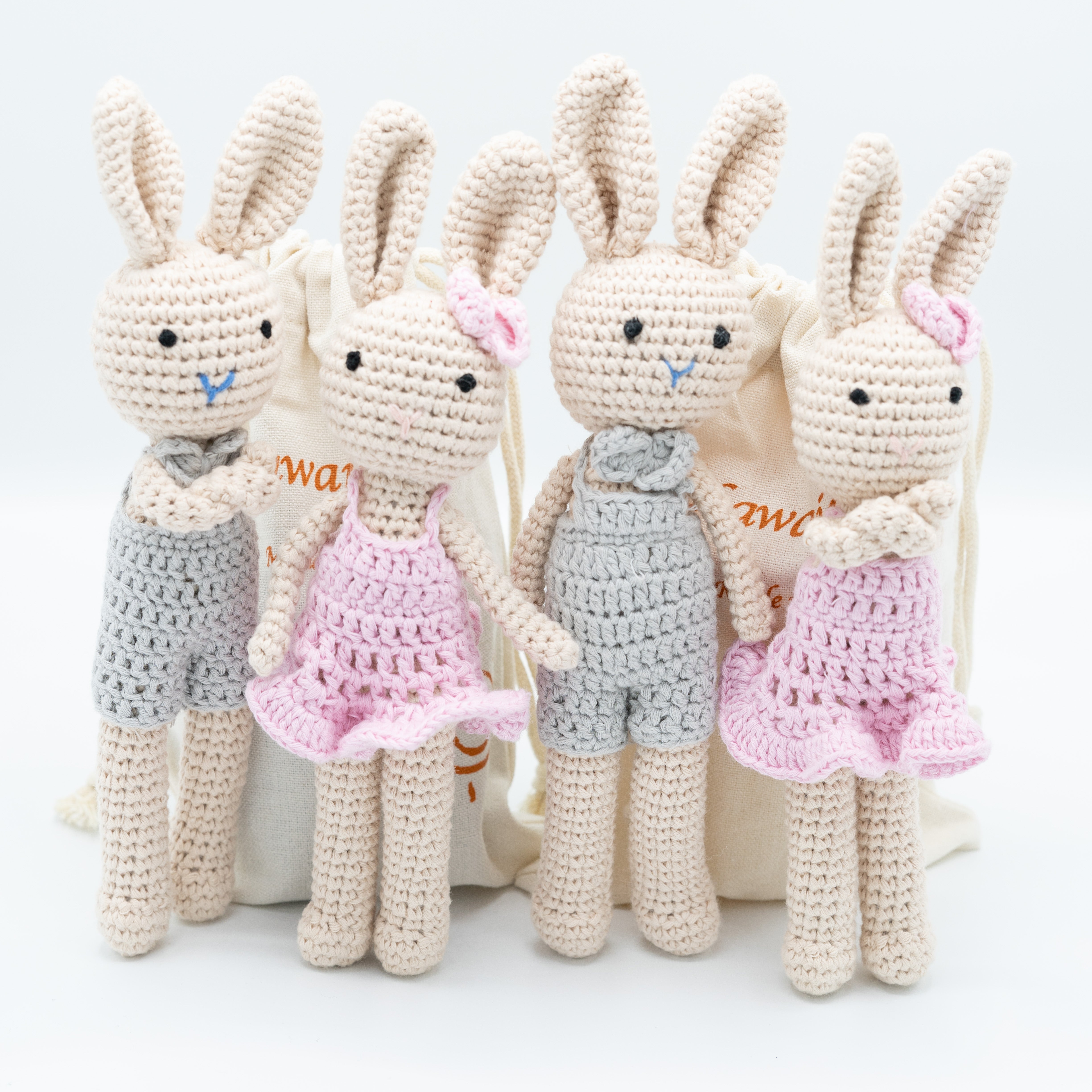 Our crochet bunny family collection made with 100% cotton standing tall together. The fully family consist of a Dad Bunny, Mom Bunny, Daughter bunny, and a Son bunny.
